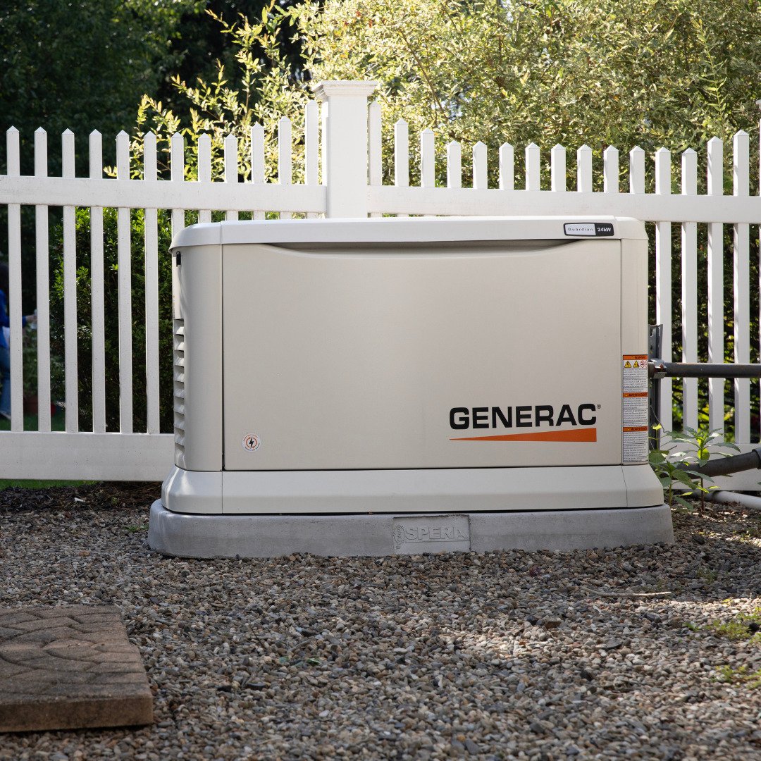 Installed Generac standby generator on a concrete pad at a home served by Brite Generators