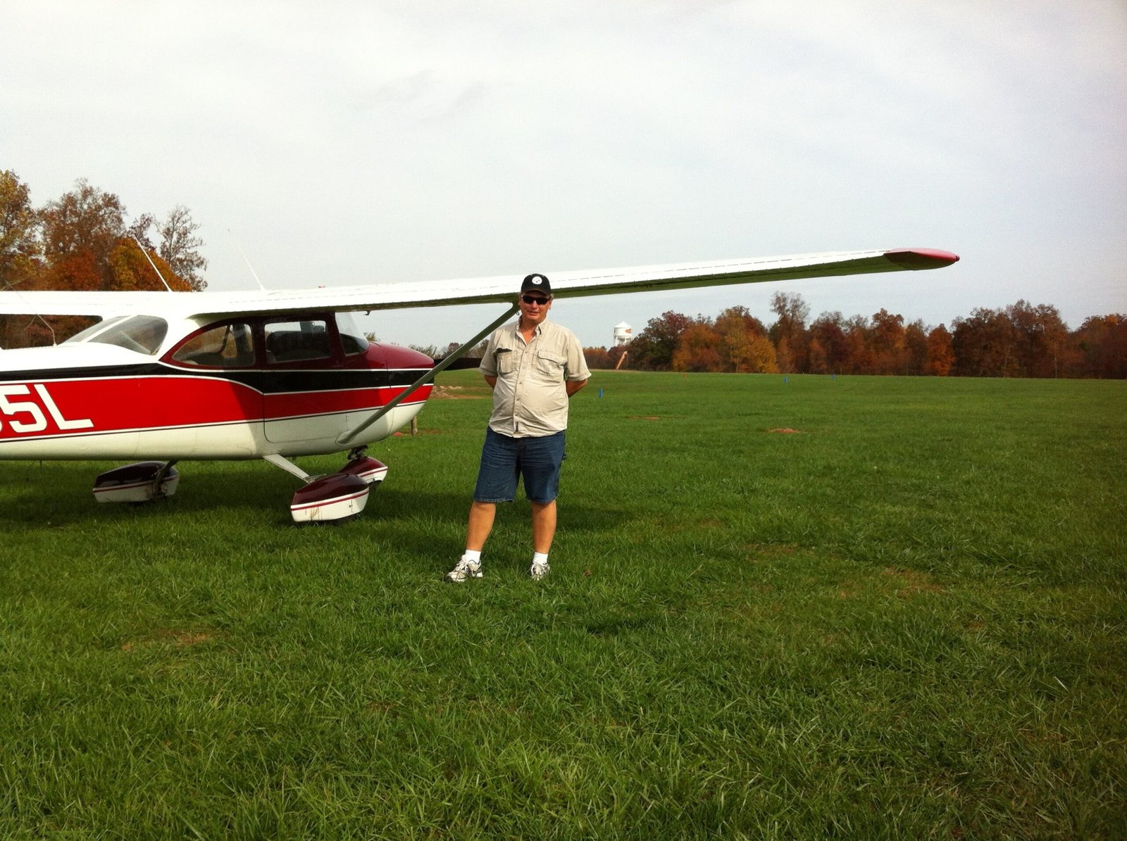 George the Electrician near an airplane